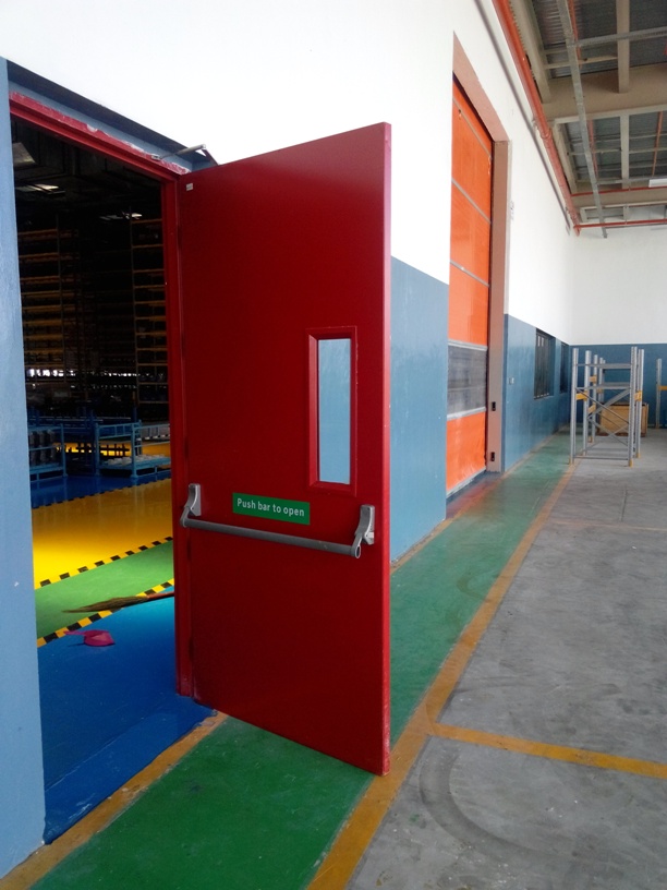 Red single door with dorma panic bar