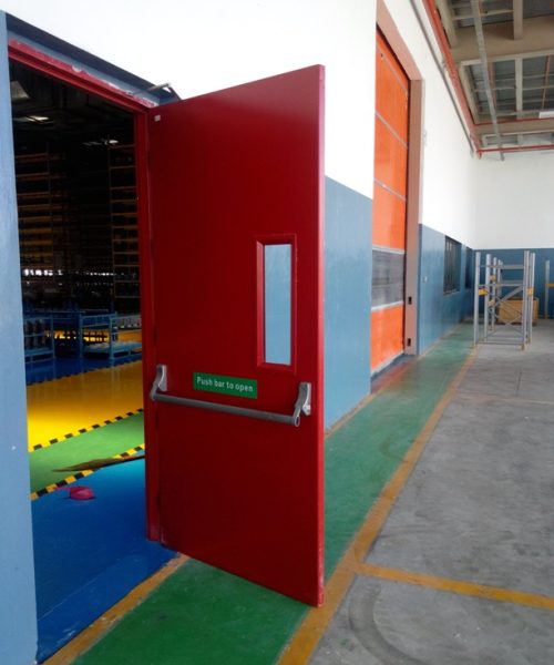 Red single door with dorma panic bar